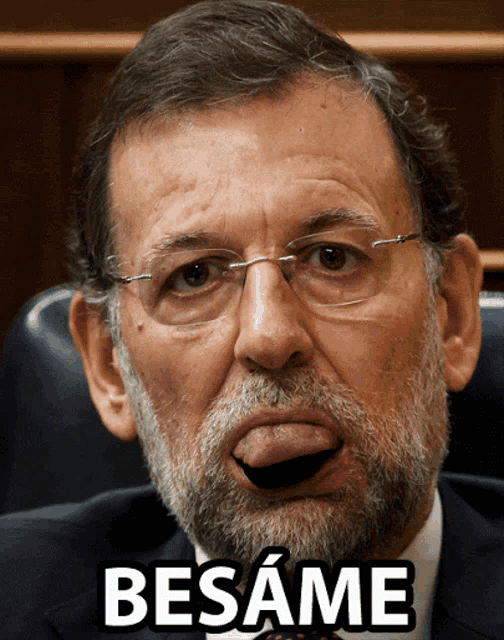 a man with glasses and a beard is making a funny face with the word besame written below him
