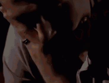 a close up of a person 's neck with a ring on it .