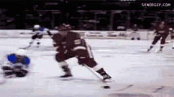 a hockey game is being played on the ice and a player with the number 21 on their jersey