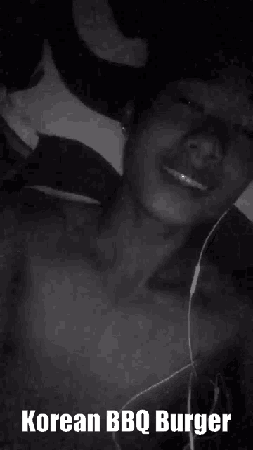 a black and white photo of a shirtless man with the words i love korean bbq burger below him