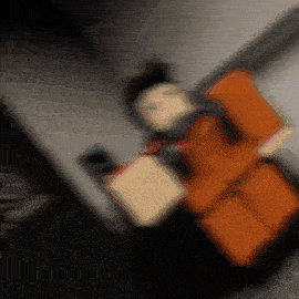 a blurry picture of a person holding a book in a dark room