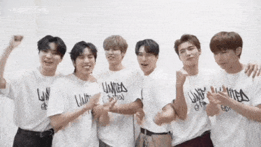a group of young men are posing for a picture and one of their shirts says limited edition