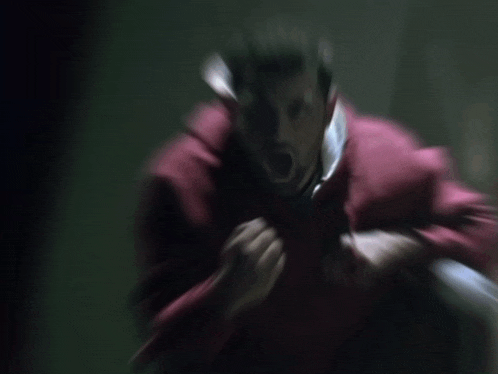 a blurry photo of a man in a red jacket