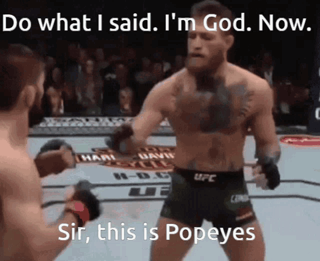 two men are fighting in a boxing ring with the caption do what i said i 'm god now