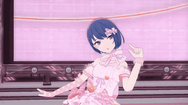 a girl in a pink dress is pointing up