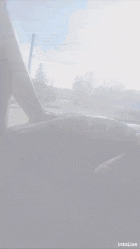 a screenshot of a car driving down a street with the words intolive below it