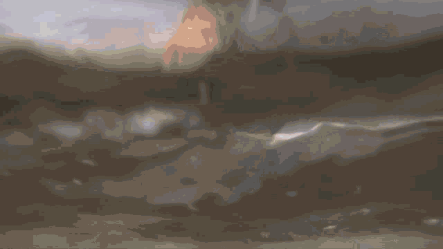 a person is swimming in the ocean with their head out of the water