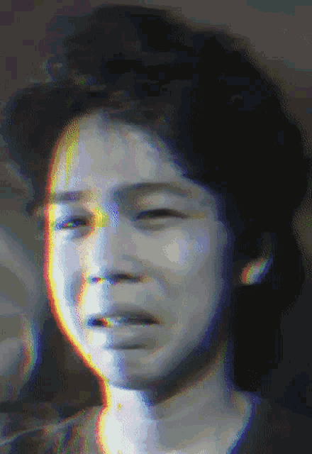 a close up of a person 's face with a glitch effect on it