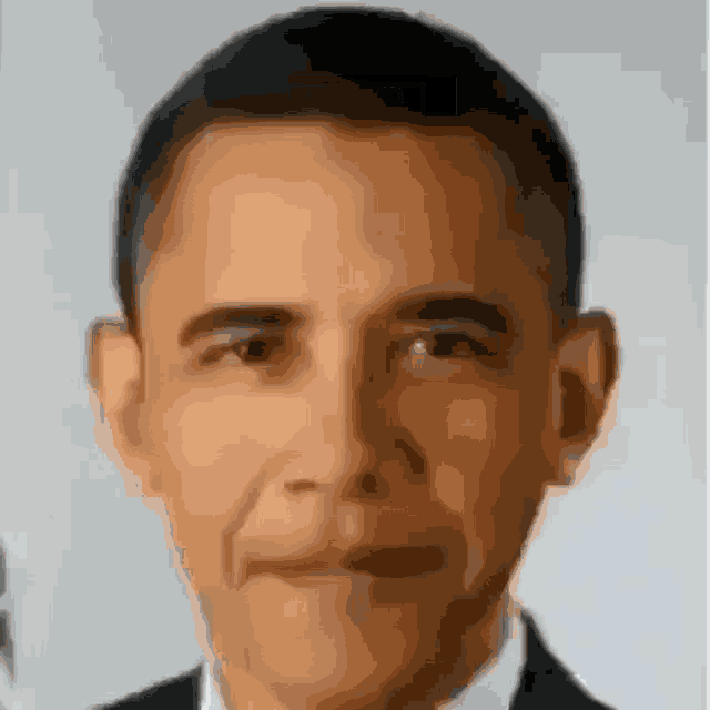 a close up of barack obama 's face in a suit and tie