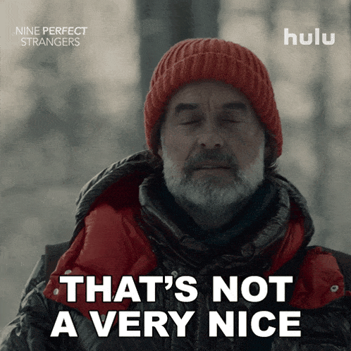 an advertisement for nine perfect strangers shows a man wearing a red hat and a black jacket