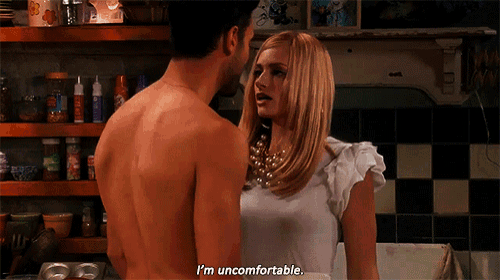 a shirtless man and a woman are looking at each other and the man says i 'm uncomfortable