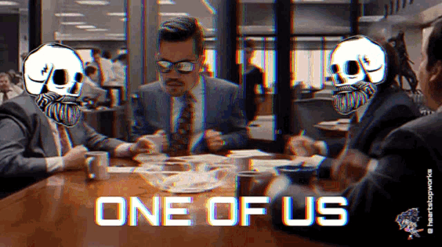 a group of men sitting around a table with the words one of us