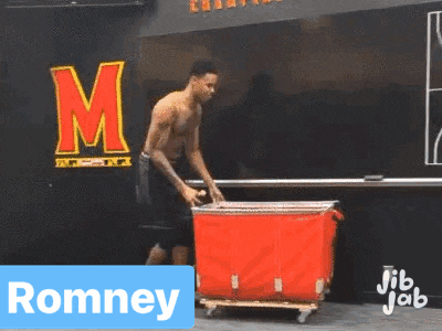 a man without a shirt is pushing a red container with the name romney on it