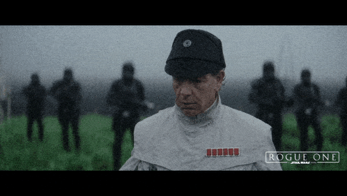 a poster for rogue one star wars shows a man in a uniform