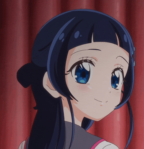 a close up of a girl 's face with her eyes closed
