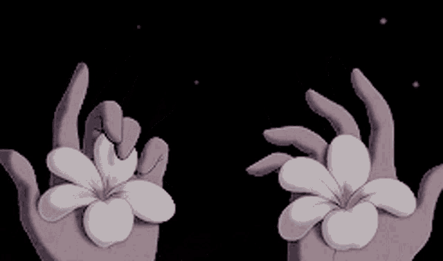 a couple of hands holding a white flower in their palms .
