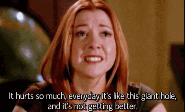 a woman with red hair says it hurts so much