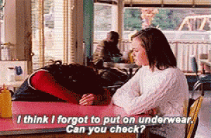 a woman sitting at a table talking to another woman with the words " i think i forgot to put on underwear "
