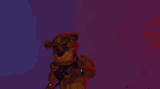 a close up of a teddy bear with a purple eye