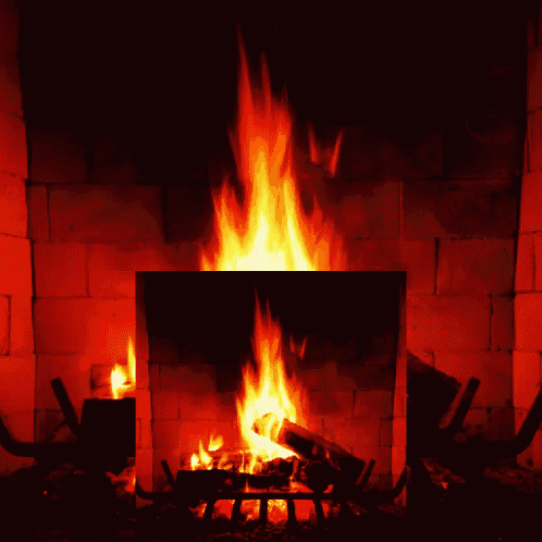 a fire is burning in a fireplace with bricks
