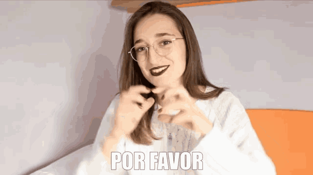 a woman wearing glasses and a white sweater has the word por favor on her face