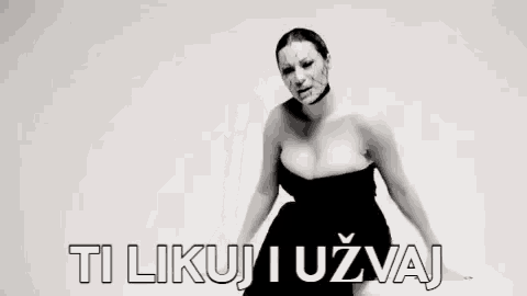 a black and white photo of a woman with blood on her face and the words `` ti likuj i uzvaj '' .