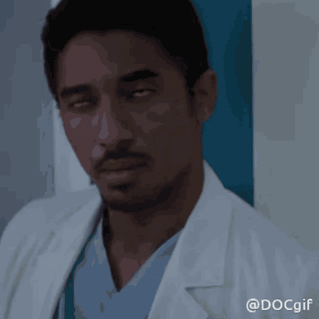 a man in a lab coat with the hashtag docgif