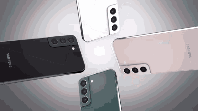 four different colored samsung phones are laying on a table