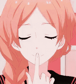 a girl with red hair is smiling with her eyes closed and her mouth open .