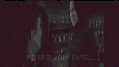 a blurry picture of a man and a woman with the words potrei vomitare