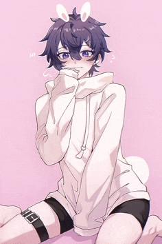 a boy with bunny ears is wearing a white hoodie and shorts .