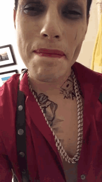 a man has a tattoo on his chest that says aa