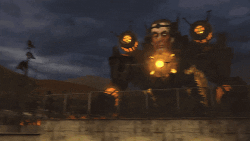 a statue of a man with a light on his face is behind a sign that says " key sucks silly "