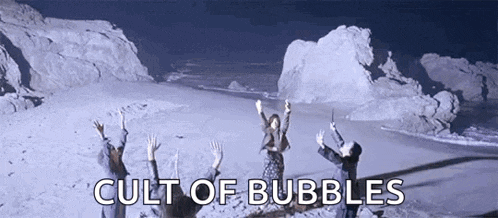 a group of people are standing on a beach with their arms in the air and the words cult of bubbles written above them .
