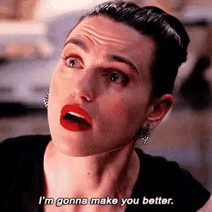 a woman with red lipstick is making a funny face and saying i 'm gonna make you better .