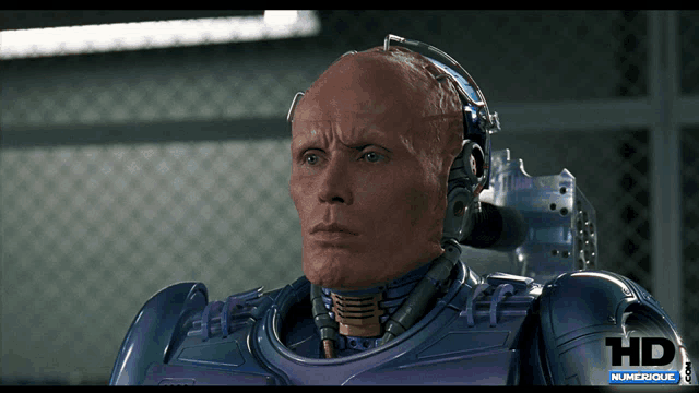 a close up of a robot 's face with the words hd numerique.com below it