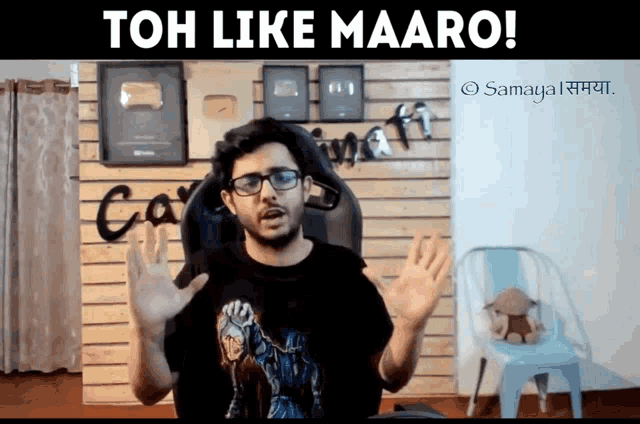 a man sitting in a chair with the words toh like maaro on the top