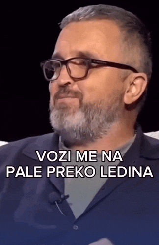 a man with glasses and a beard has the words vozi me na pale preko ledina above him