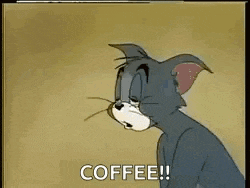 a cartoon cat is holding a cup of coffee and saying `` coffee '' .