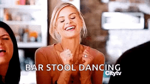 a woman is laughing with her hands in the air and the words bar stool dancing are above her .