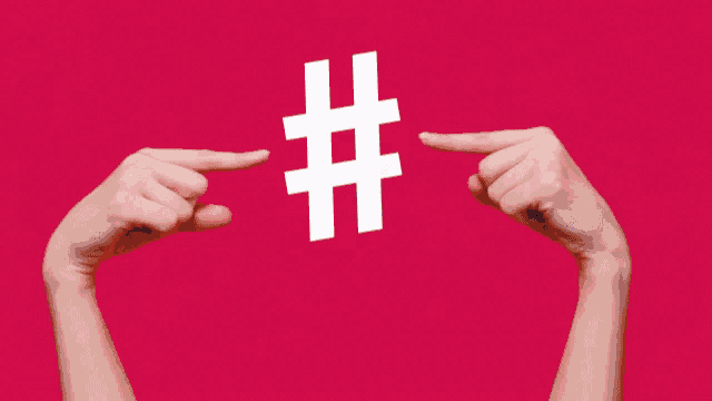 a person is giving a thumbs up in front of a red background that says #teambayer