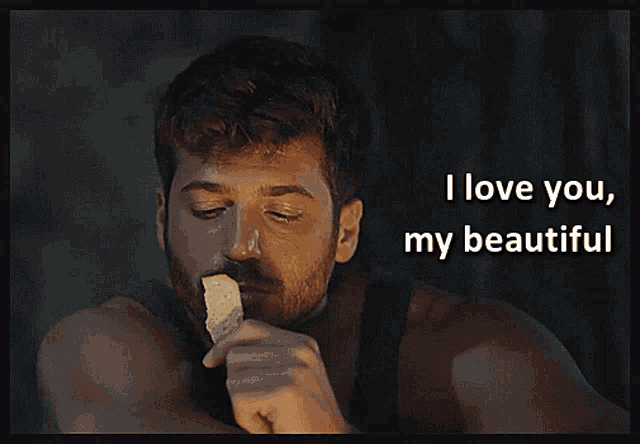 a man eating a piece of bread with the words i love you my beautiful above him