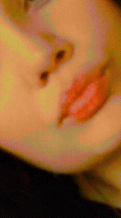 a close up of a woman 's face with red lips and a black background