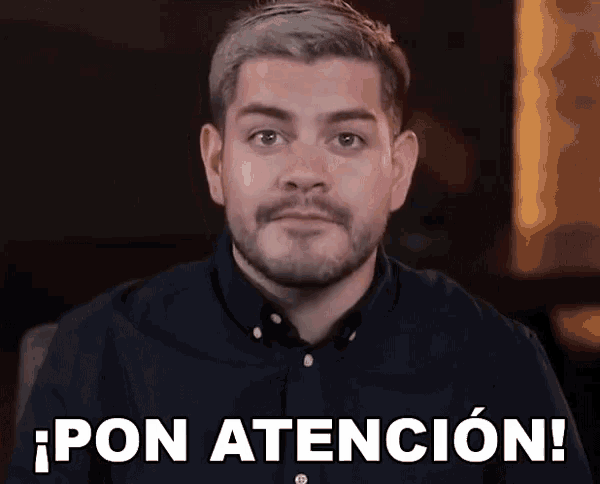 a man with a beard is looking at the camera and says pon atencion