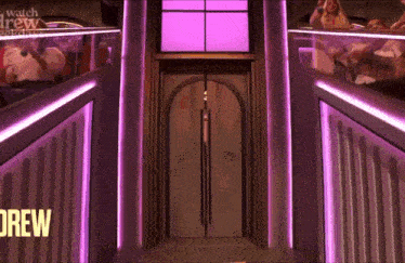 a doorway with purple lights and a sign that says drew