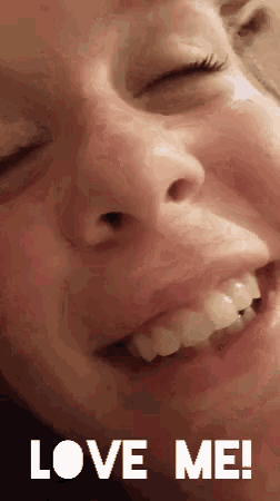 a close up of a woman 's face with the words love me written below her