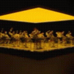 a group of people are standing under a yellow triangle .