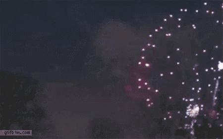 a purple fireworks display is going off in the night sky