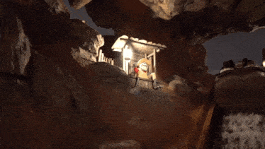 a cartoon character in a cave with a lantern in his hand