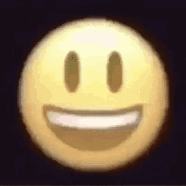 a close up of a smiley face with a smile on it .